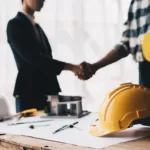 Construction worker team hands shaking greeting start up plan new project contract in office