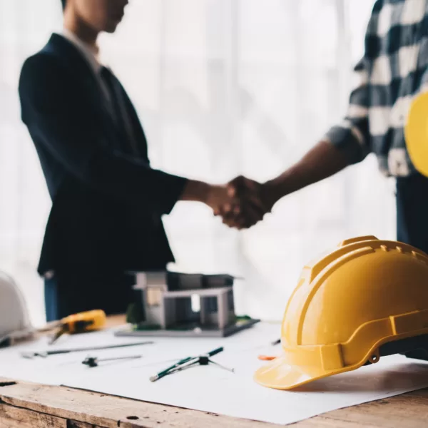 Construction worker team hands shaking greeting start up plan new project contract in office