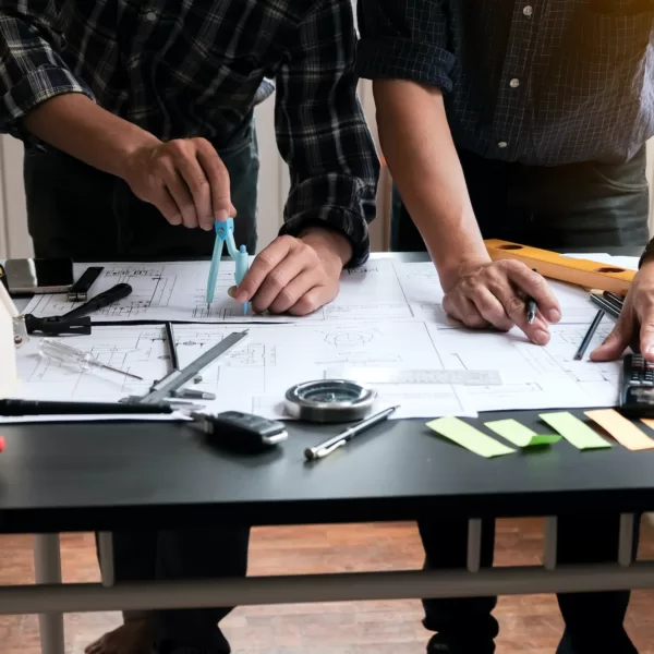 Two engineer meeting and planning construction project together.
