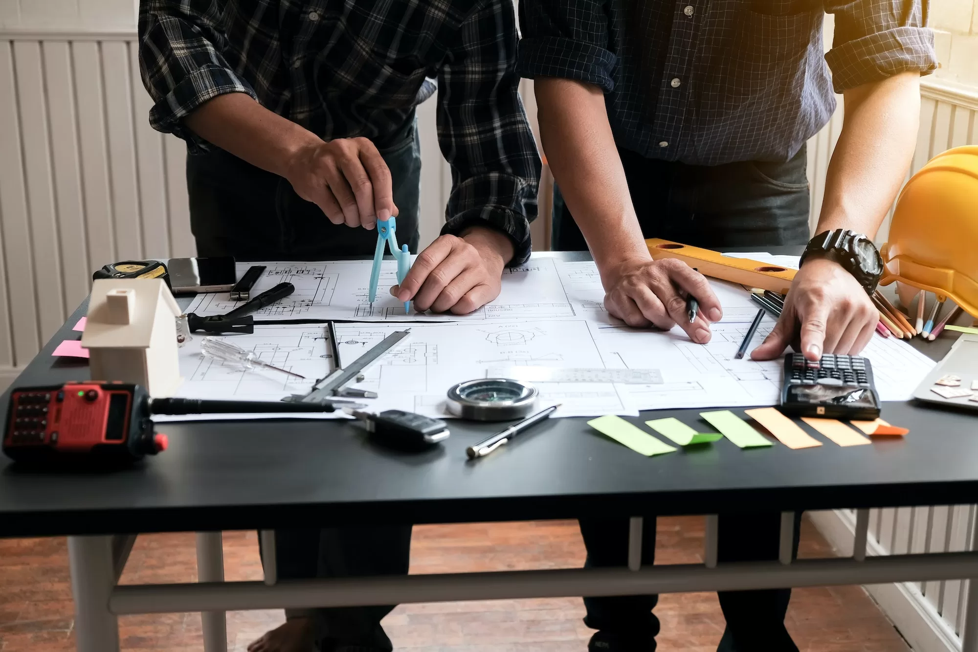 Two engineer meeting and planning construction project together.
